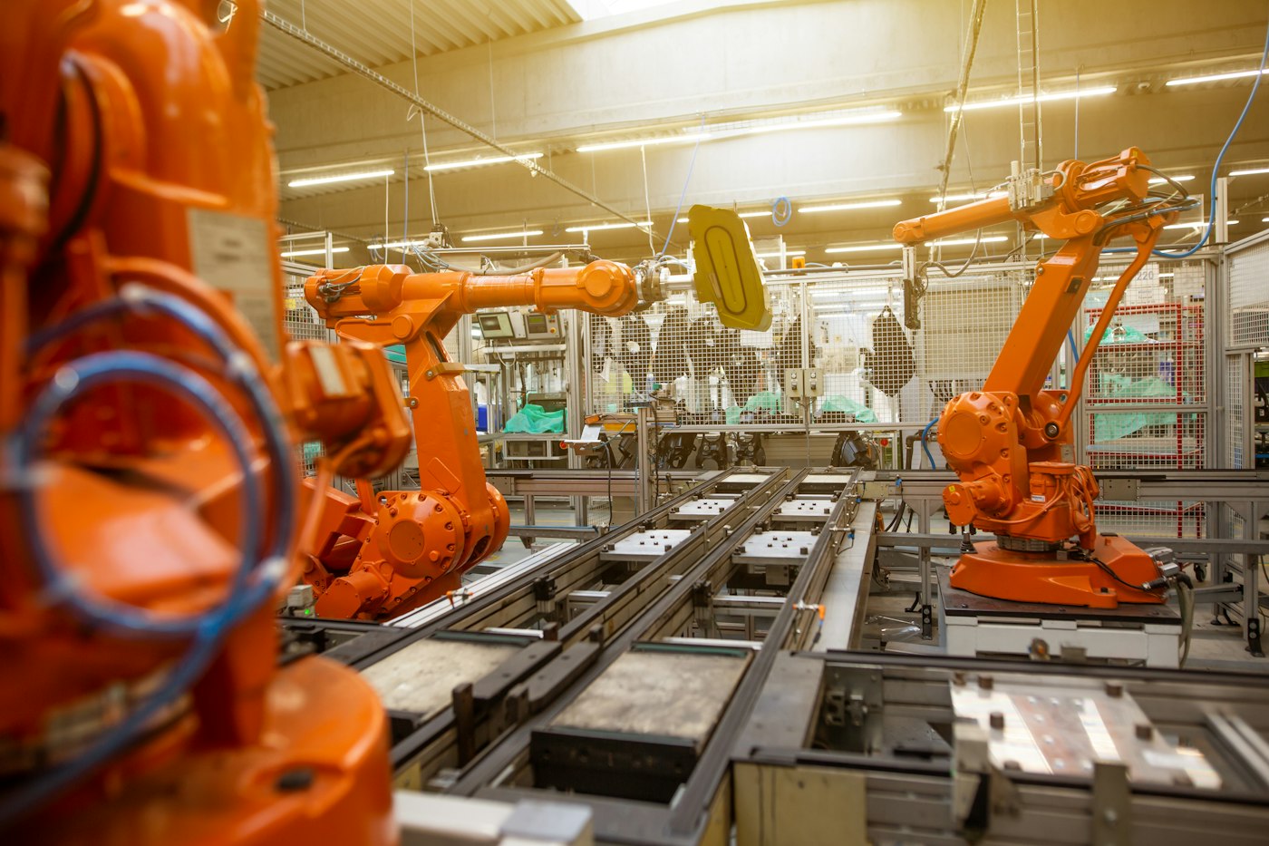 Industrial robotic arms on an automated line